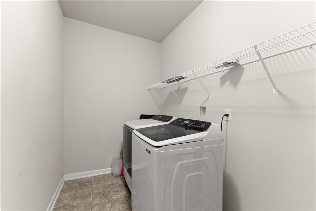 2228 Lakeview Bend Way Buford, GA 30519 - Photo 26 of 36 a utility room with dryer and washer