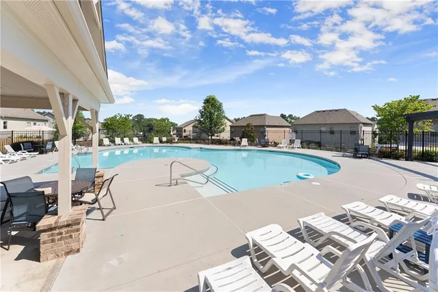a view of a swimming pool with a patio