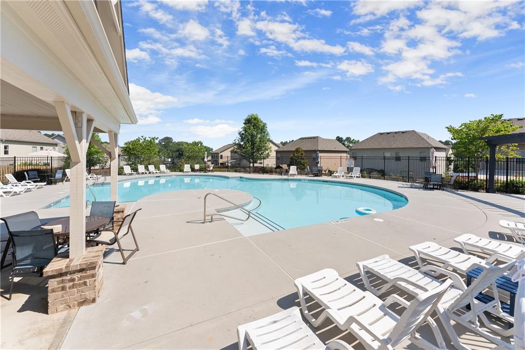 2228 Lakeview Bend Way Buford, GA 30519 - Photo 33 of 36 a view of a swimming pool with a patio