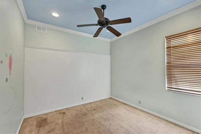 a view of an empty room with a window