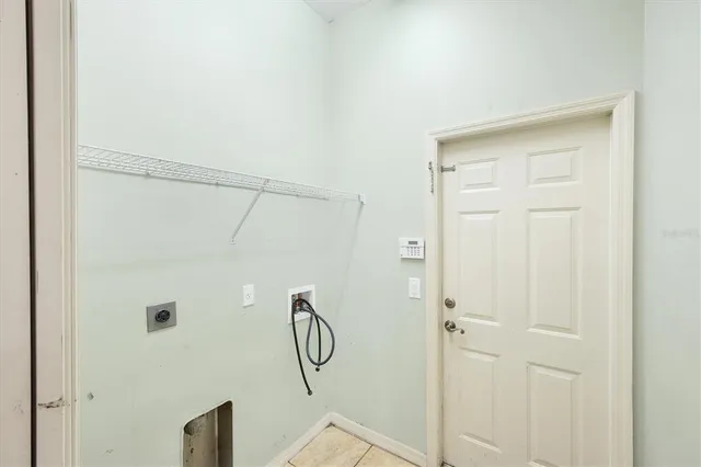 a view of a dinning room with a table and chairs