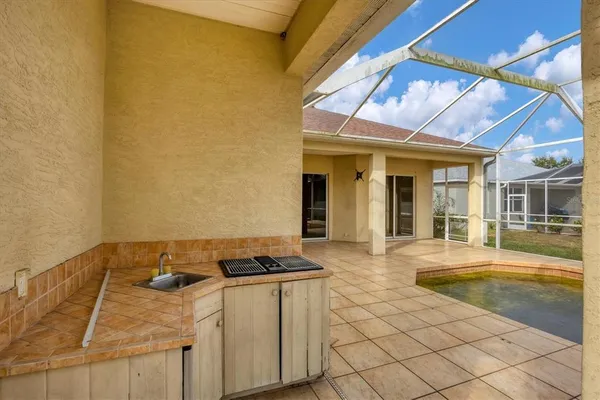 a front view of house with yard and lake