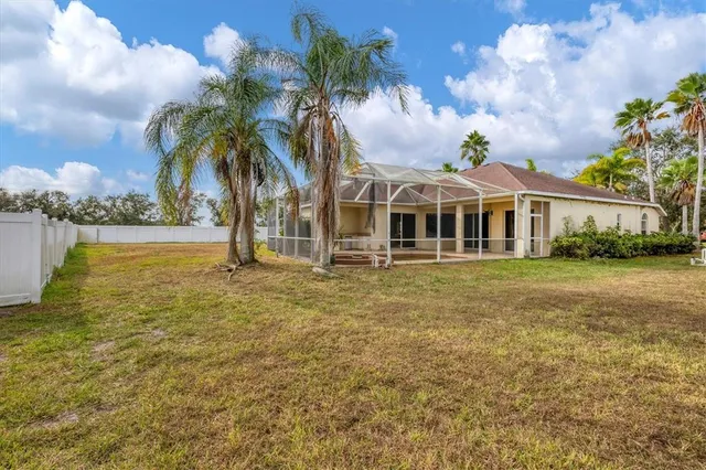 an aerial view of house with yard