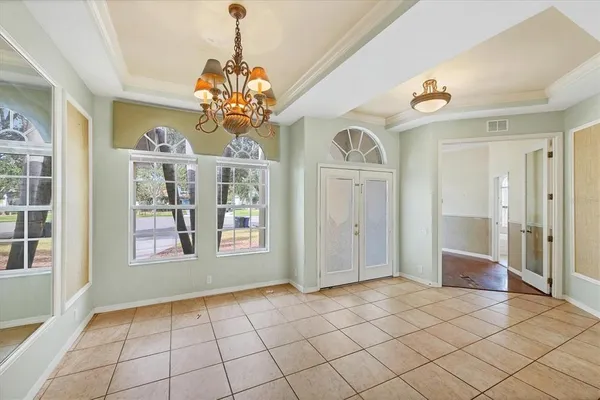 a view of an entryway with a chandelier