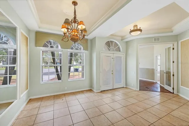 a view of an entryway with a chandelier
