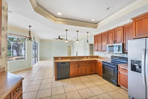 a kitchen with stainless steel appliances granite countertop a sink and cabinets