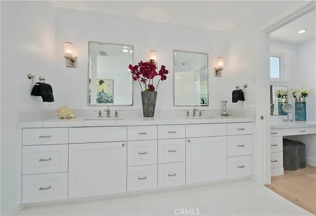 a bathroom with a tub sink a window and a shower