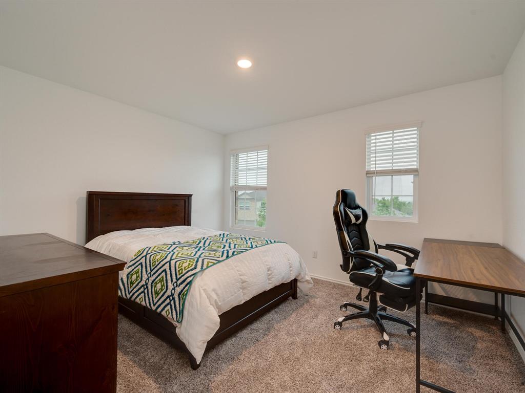 1208 Sweetspire Street Leander, TX 78641 - Photo 25 of 36 Carpeted room featuring two windows with horizontal blinds, recessed lighting, and white walls