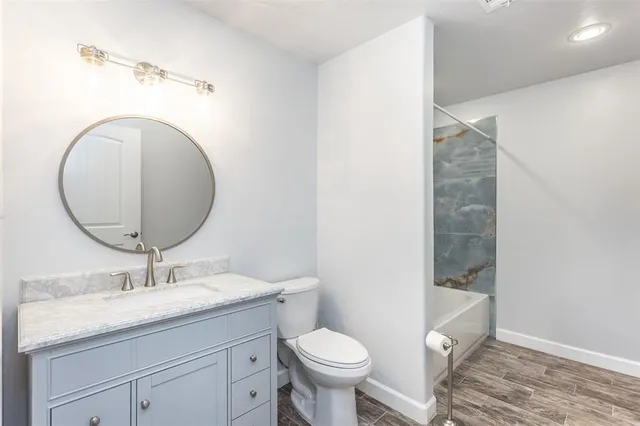 a bedroom with a large bed and a large window with the outer view