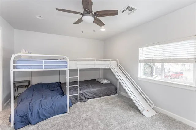 a bathroom with a shower and a mirror
