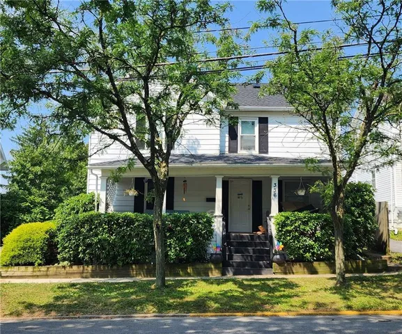 front view of a house with a yard