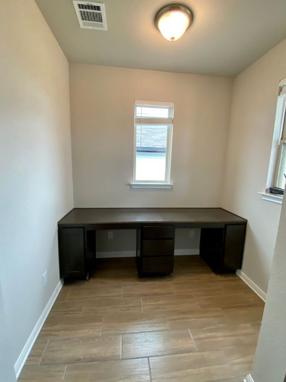 103 Wild Wind Cove Jarrell, TX 76537 - Photo 2 of 11 a room with a bench