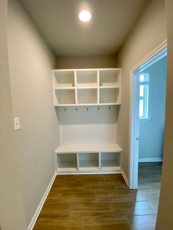 103 Wild Wind Cove Jarrell, TX 76537 - Photo 3 of 11 a view of a room with wooden floor and a window
