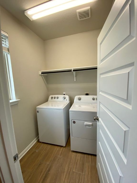 103 Wild Wind Cove Jarrell, TX 76537 - Photo 4 of 11 a utility room with dryer and washer