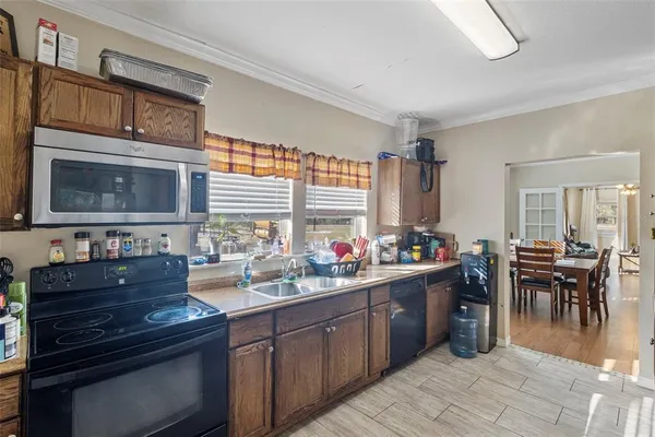 a kitchen with lots of counter top space and dining table