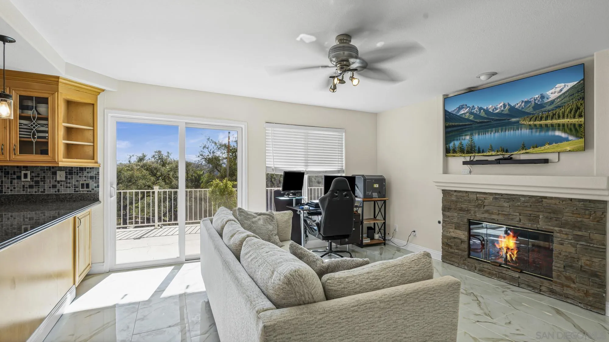 24249 Sargeant Road Ramona, CA 92065 - Photo 11 of 46 a living room with furniture a flat screen tv and a fireplace