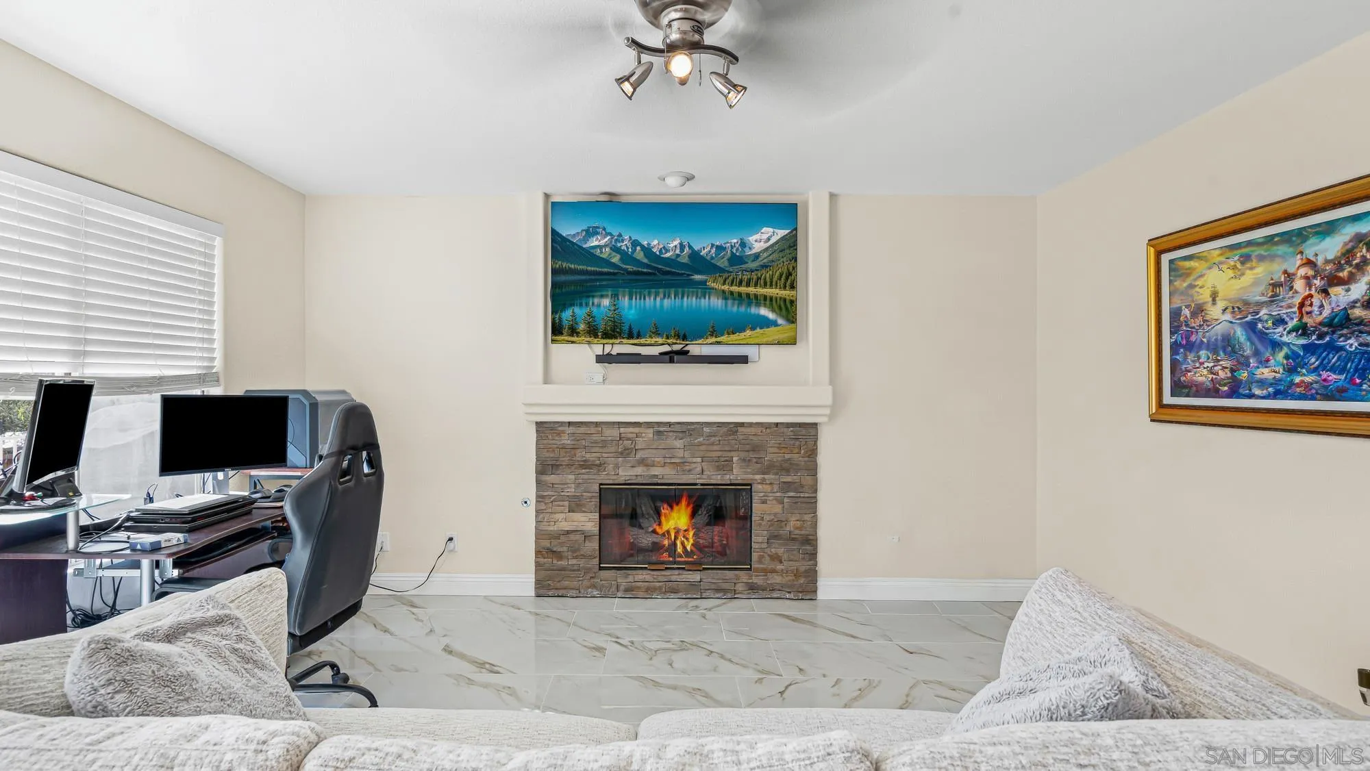 24249 Sargeant Road Ramona, CA 92065 - Photo 12 of 46 a living room with furniture a fireplace and a flat screen tv