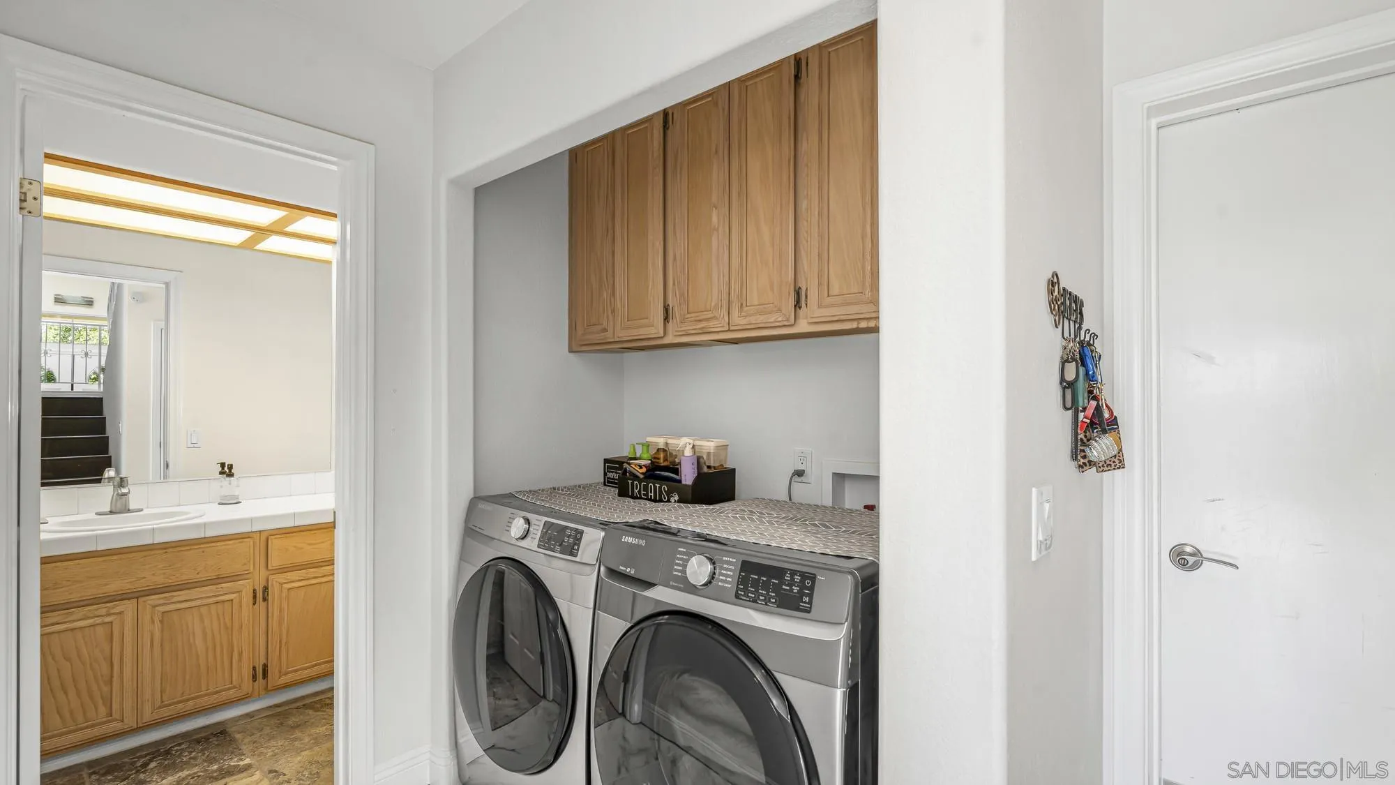24249 Sargeant Road Ramona, CA 92065 - Photo 14 of 46 a utility room with sink dryer and washer