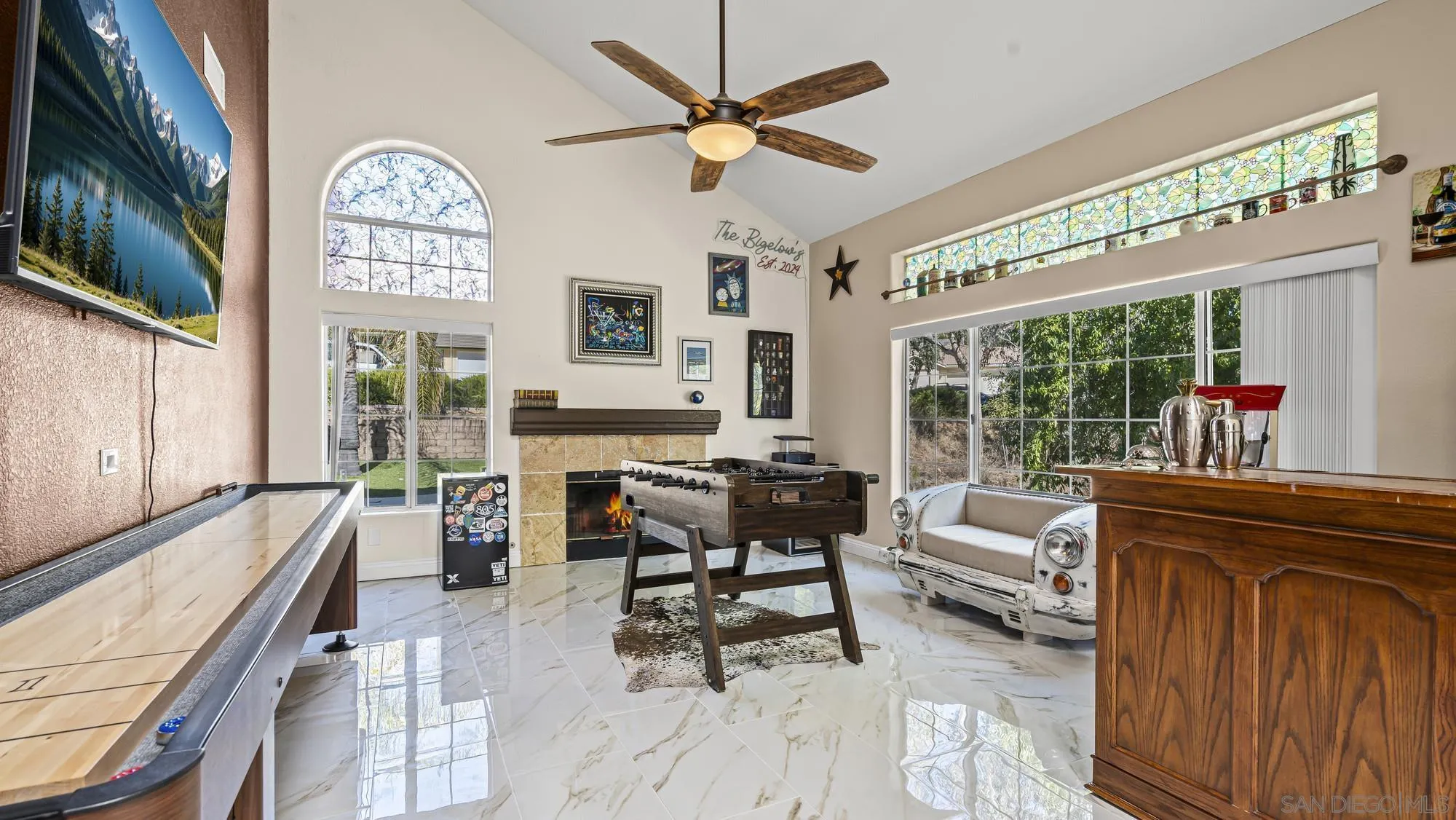 24249 Sargeant Road Ramona, CA 92065 - Photo 2 of 46 a living room with furniture a fireplace and a large window