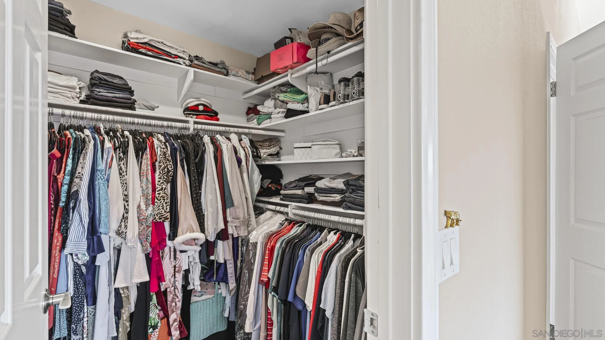 24249 Sargeant Road Ramona, CA 92065 - Photo 22 of 46 a view of walk in closet with clothes and shoes