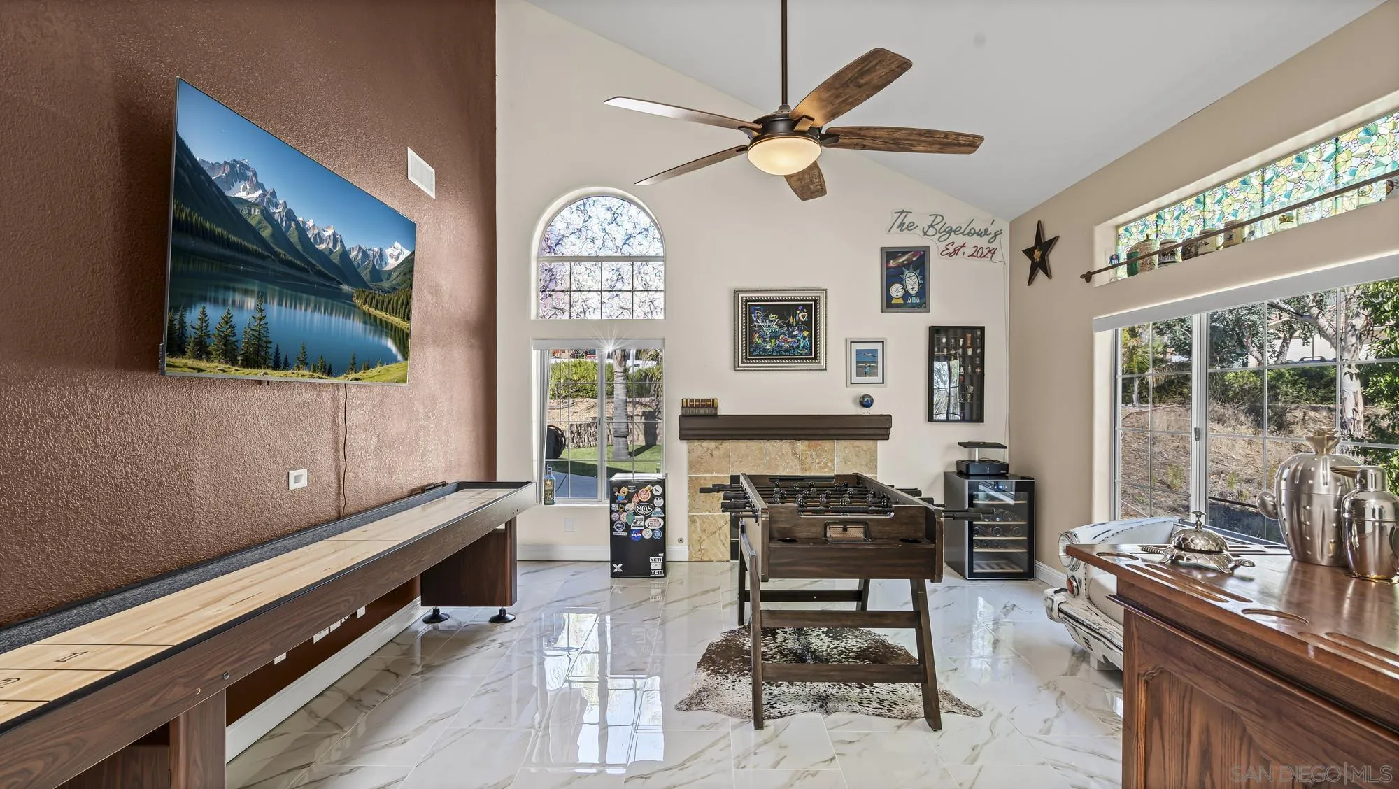 24249 Sargeant Road Ramona, CA 92065 - Photo 3 of 46 a living room with furniture a flat screen tv and a large window