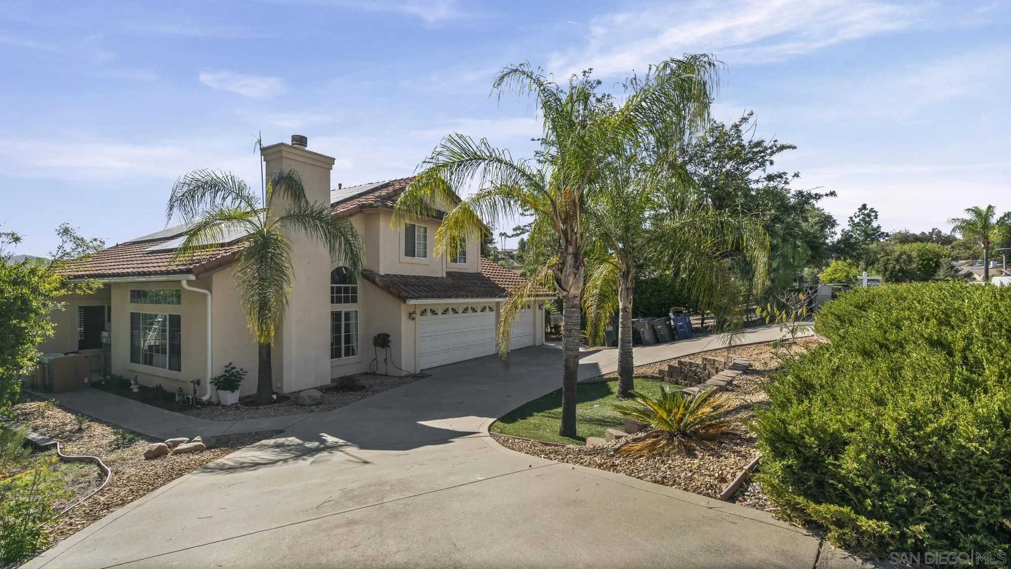 24249 Sargeant Road Ramona, CA 92065 - Photo 34 of 46 a front view of a house with a yard and garage