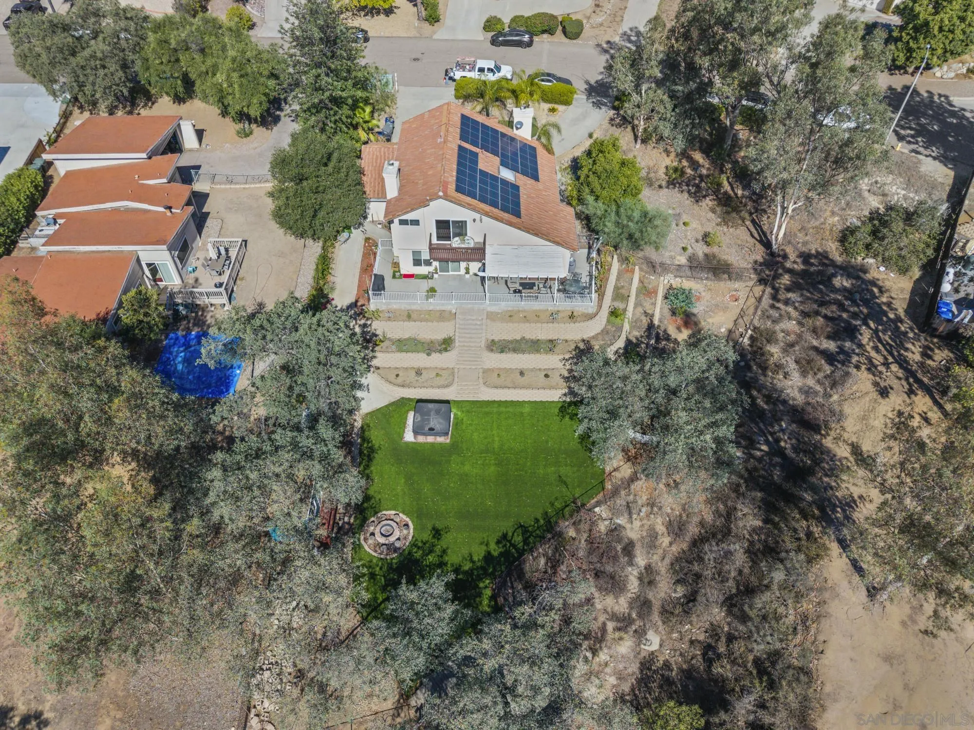 24249 Sargeant Road Ramona, CA 92065 - Photo 36 of 46 an aerial view of a house with a yard and trees all around