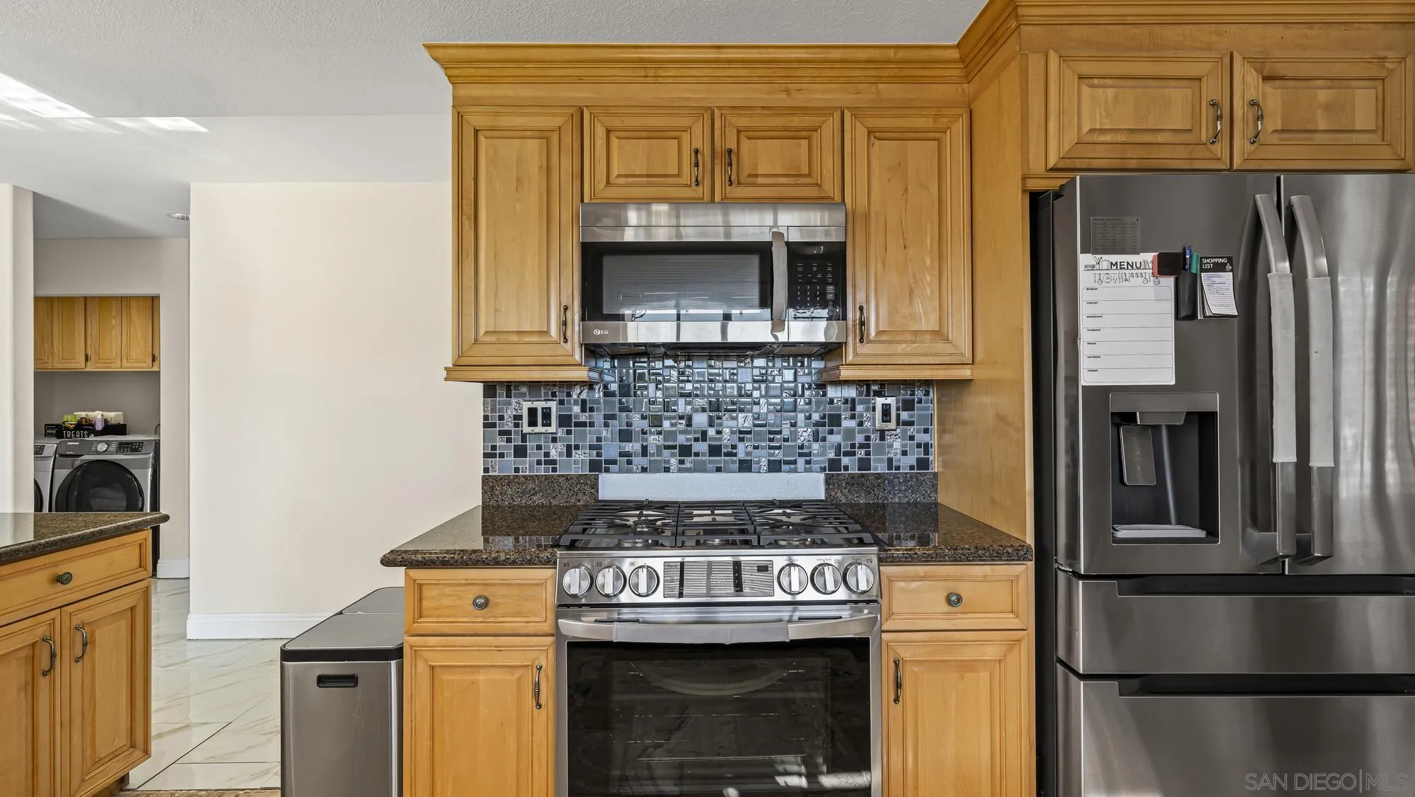 24249 Sargeant Road Ramona, CA 92065 - Photo 9 of 46 a kitchen with a stove and refrigerator