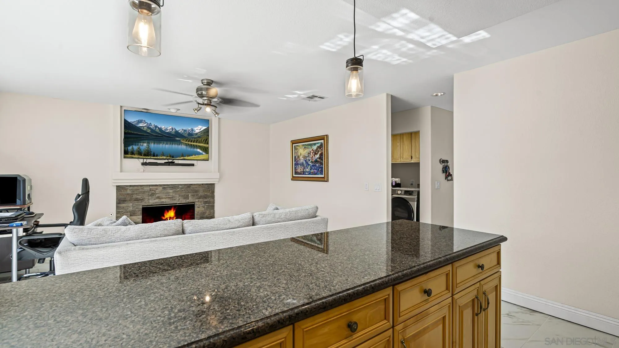 24249 Sargeant Road Ramona, CA 92065 - Photo 10 of 46 a living room with fireplace furniture and a flat screen tv