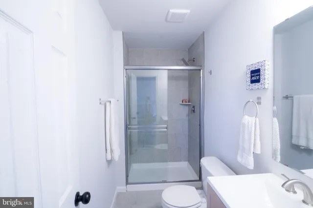a bathroom with a shower and toilet
