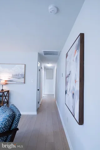 a area with wooden floor and furniture