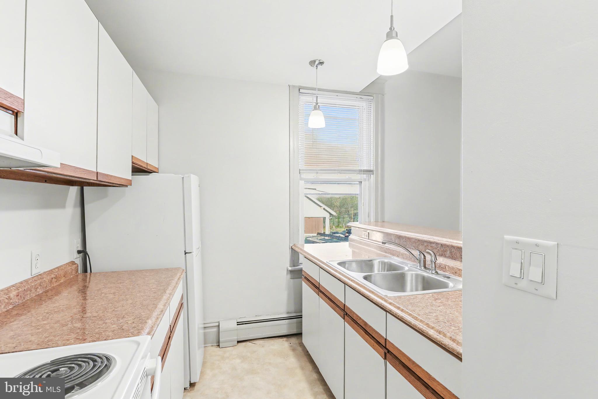143 15th Street, Unit 1 New Cumberland, PA 17070 - Photo 5 of 10 a bathroom with a granite countertop sink and a bathtub