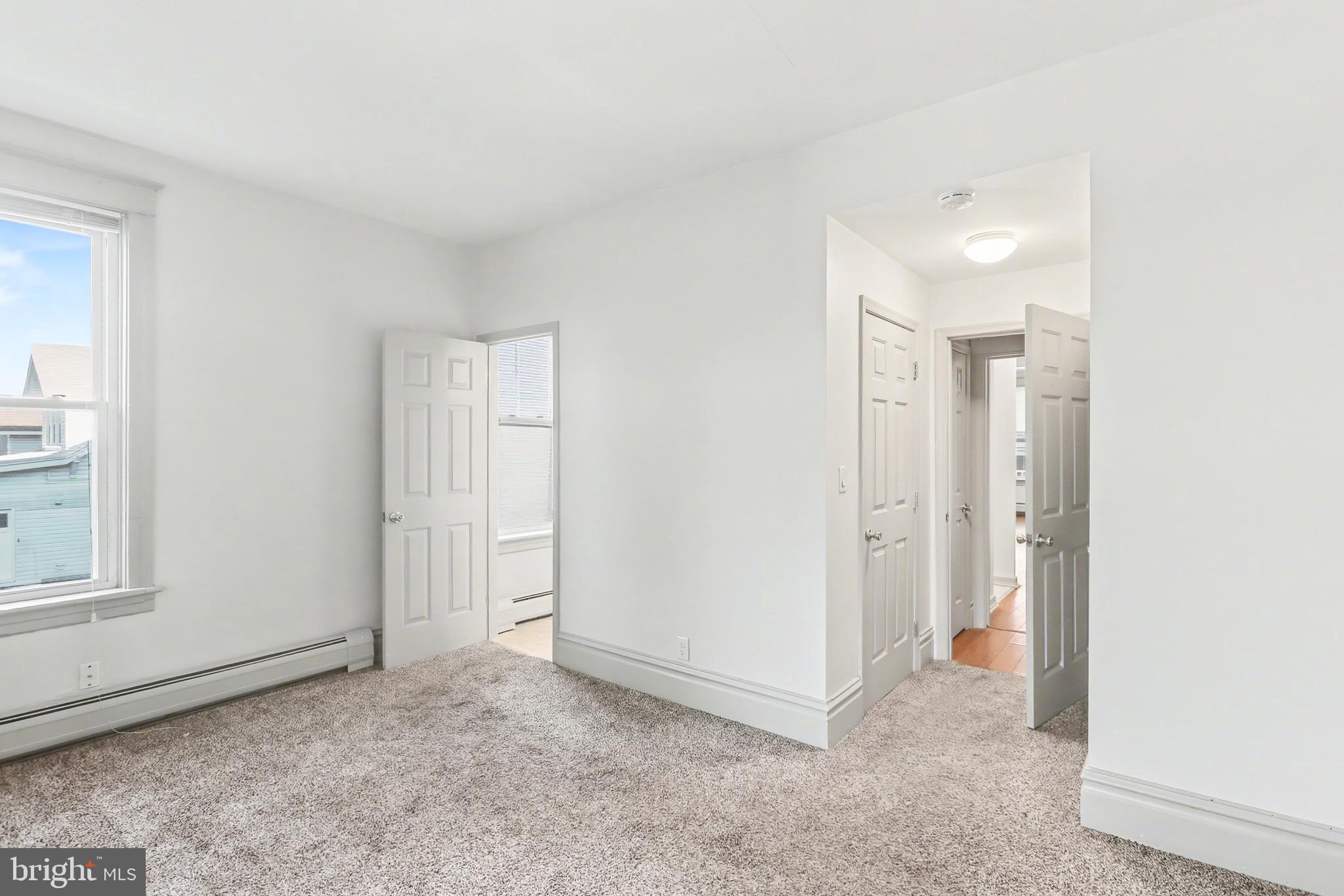 143 15th Street, Unit 1 New Cumberland, PA 17070 - Photo 6 of 10 a view of an empty room and window