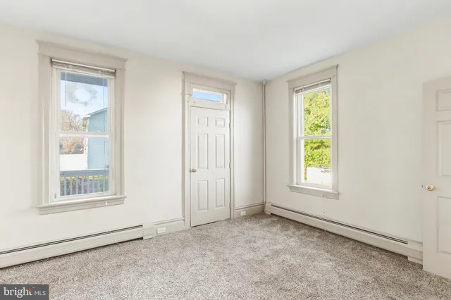 an empty room with windows