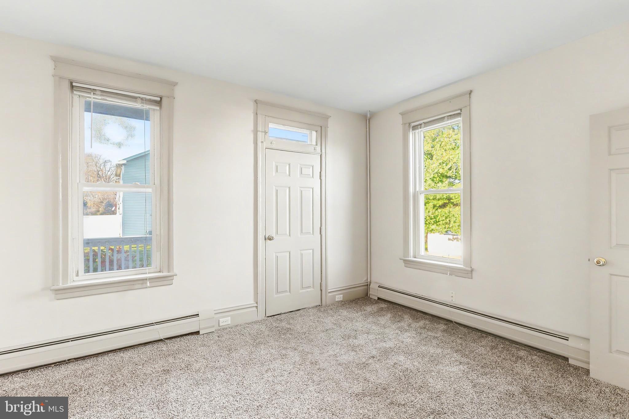 143 15th Street, Unit 1 New Cumberland, PA 17070 - Photo 8 of 10 an empty room with windows