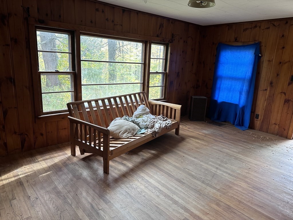 24 East Hawley Road Hawley, MA 01339 - Photo 3 of 13 a bed sitting in a bedroom next to a window