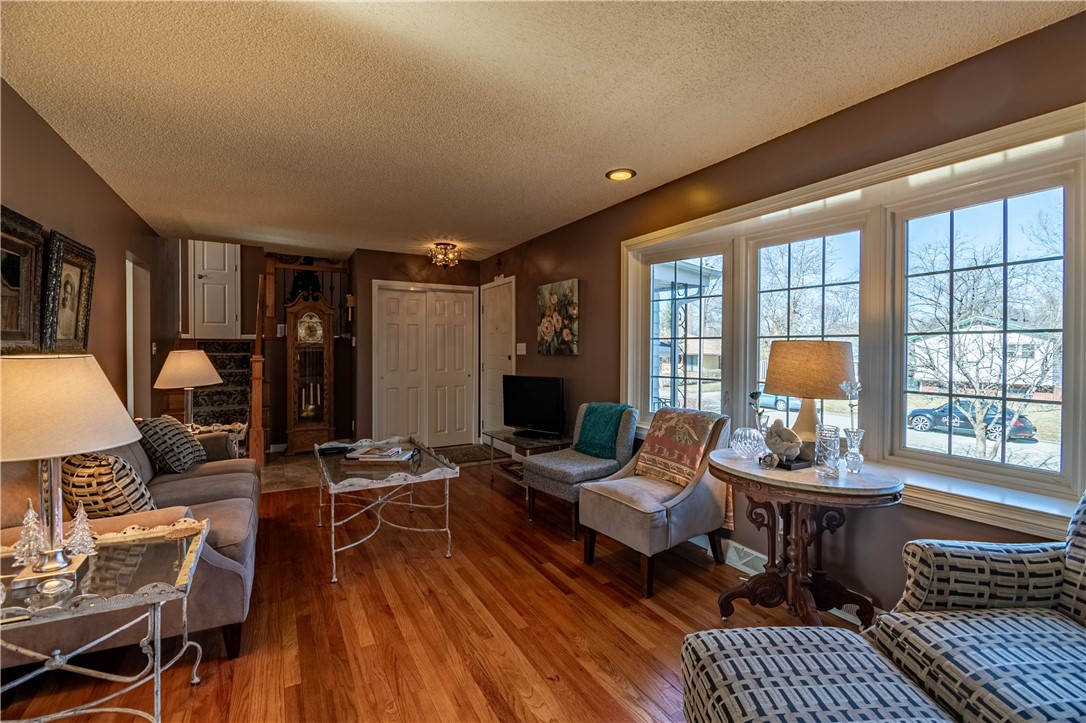 75 Ridgedale Drive Decatur, IL 62521 - Photo 5 of 26 a living room with fireplace furniture and a large window