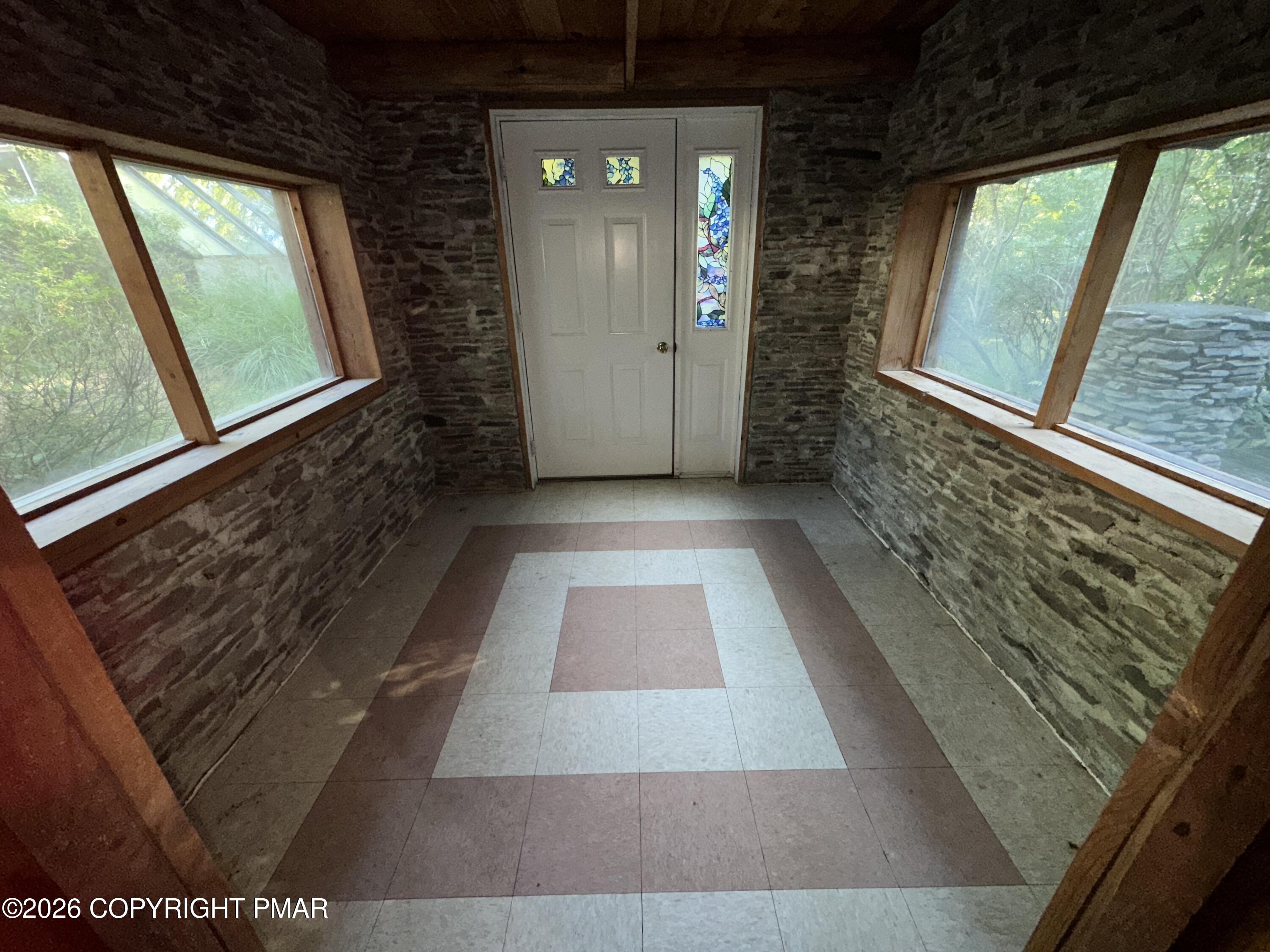 1122 Zephyr Road East Stroudsburg, PA 18302 - Photo 31 of 38 ENCL. PORCH OFF LIV. RM.