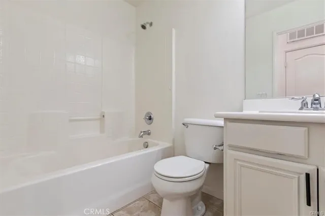 a bathroom with a sink toilet and bathtub