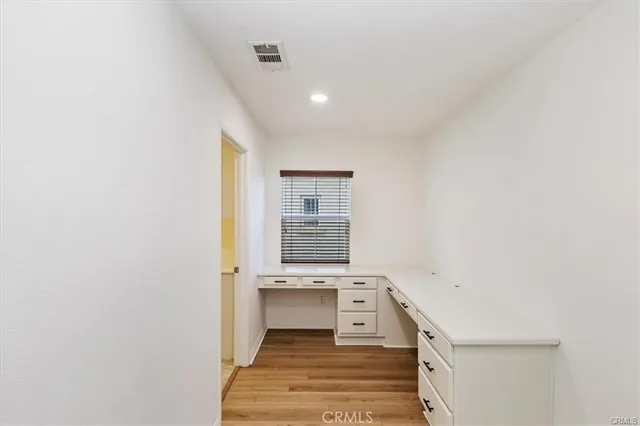 a bathroom with a sink a vanity and a window