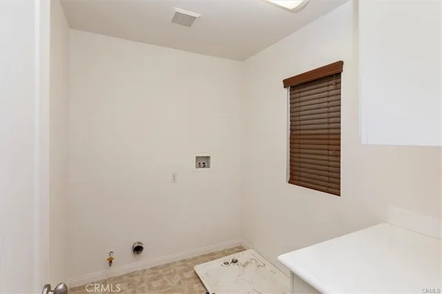 a bathroom with a sink and a window