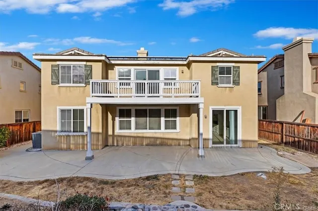 a front view of a residential apartment building with a yard
