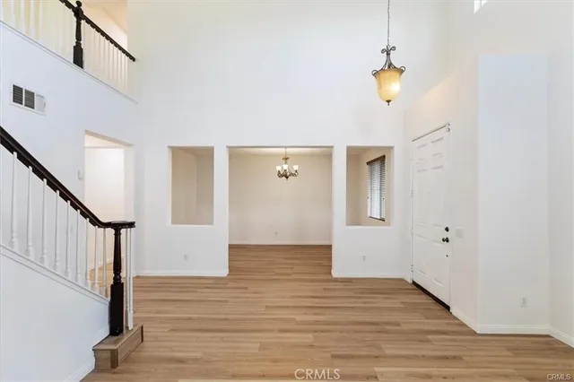 a view of an entryway with wooden floor