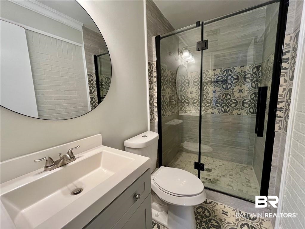 8636 Boe Road Irvington, AL 36544 - Photo 11 of 22 Full bathroom with vanity and a stall shower
