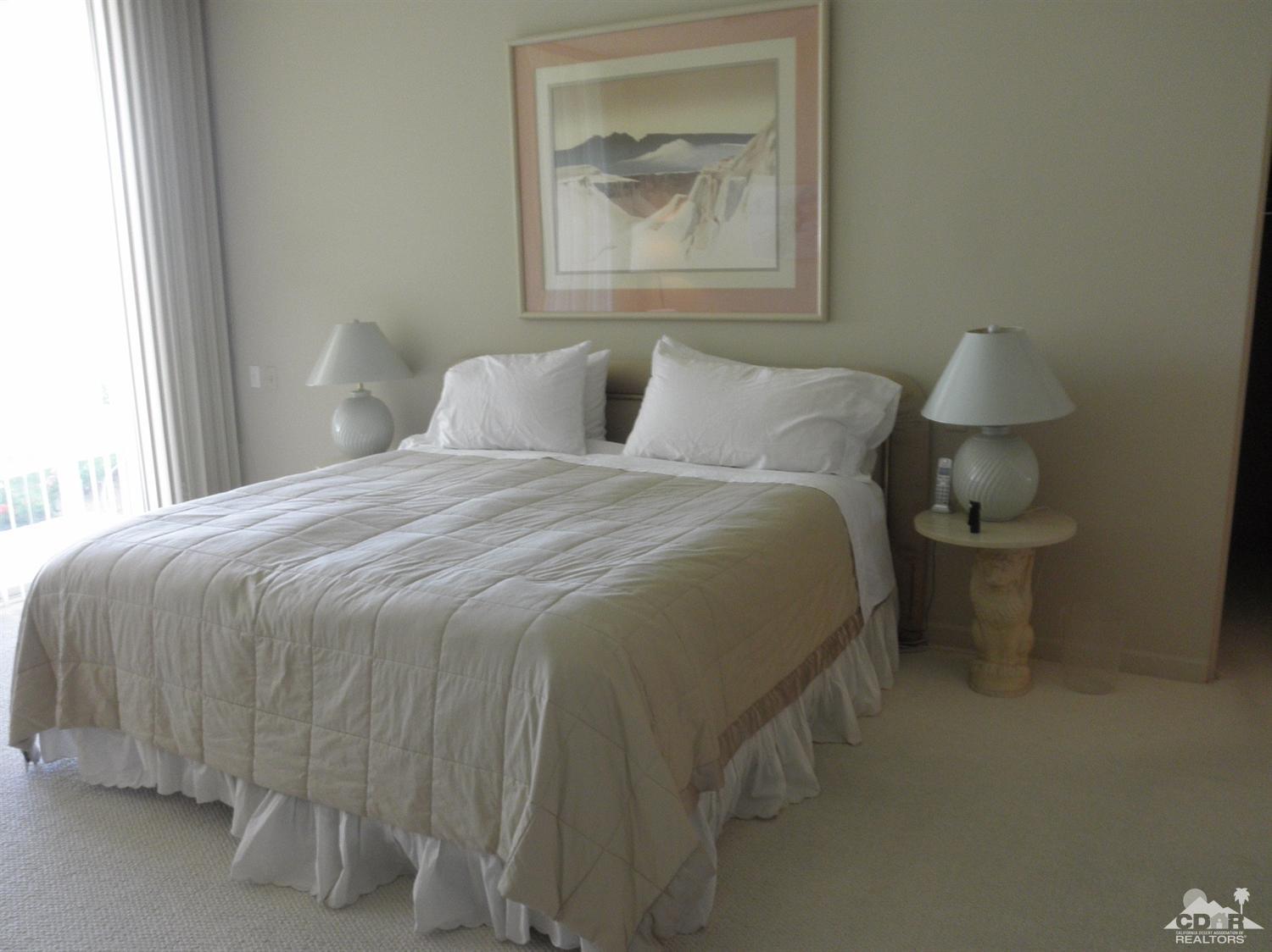 47432 Rabat Drive Palm Desert, CA 92260 - Photo 12 of 21 a bedroom with a bed and a painting on the wall