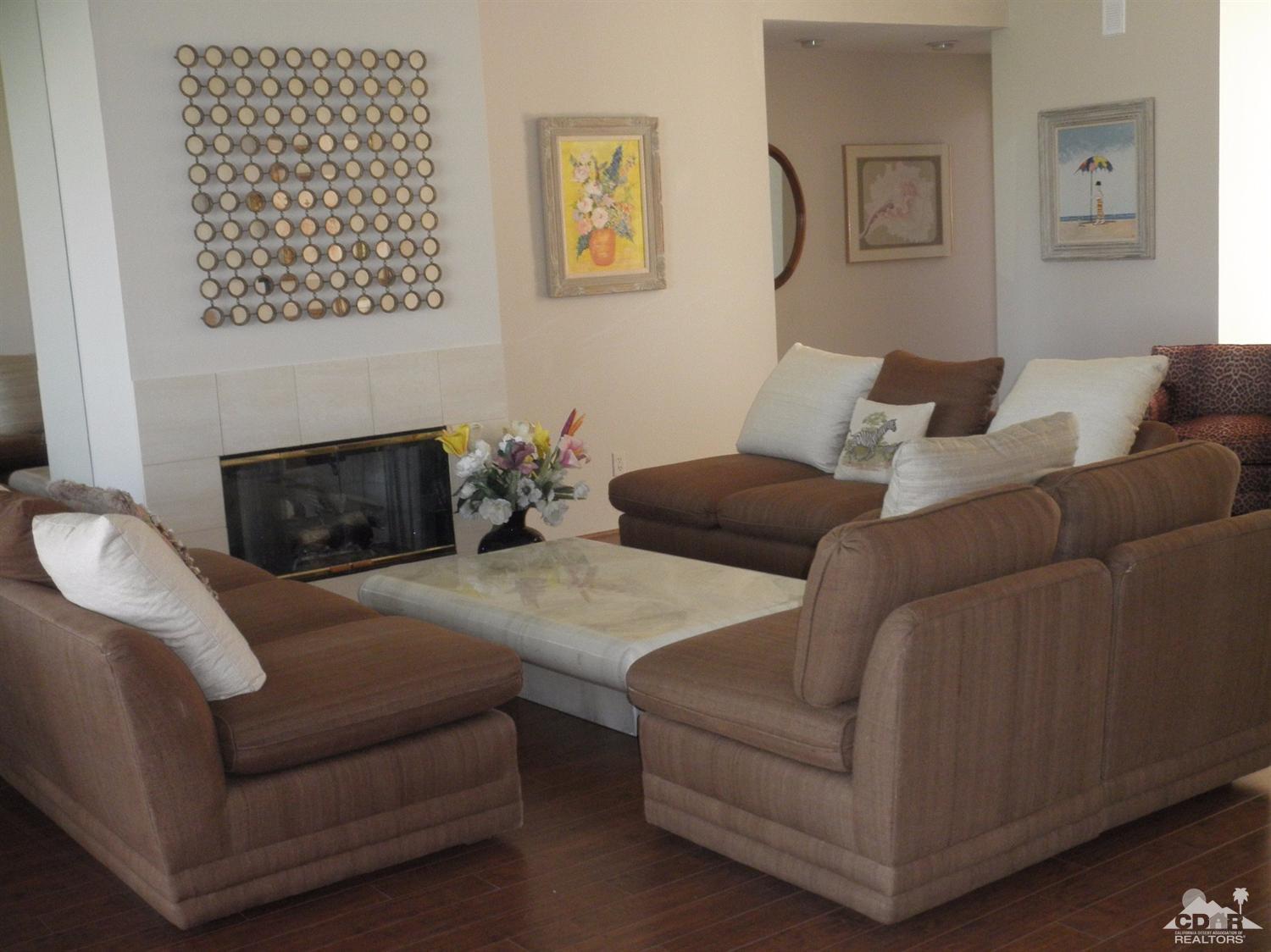 47432 Rabat Drive Palm Desert, CA 92260 - Photo 5 of 21 a living room with furniture and a fireplace