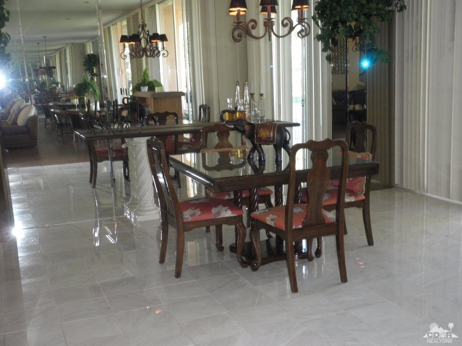 47432 Rabat Drive Palm Desert, CA 92260 - Photo 7 of 21 a view of a dining room with furniture and chandelier