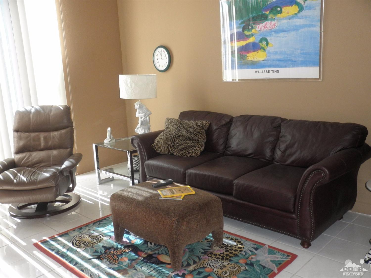 47432 Rabat Drive Palm Desert, CA 92260 - Photo 8 of 21 a living room with furniture and a mirror