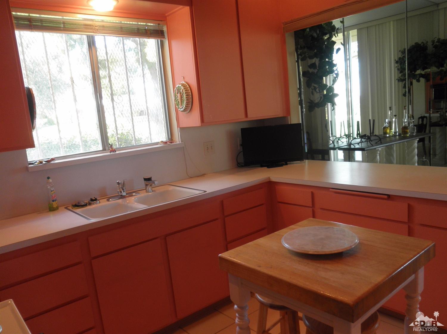 47432 Rabat Drive Palm Desert, CA 92260 - Photo 10 of 21 a kitchen with a sink window and cabinets