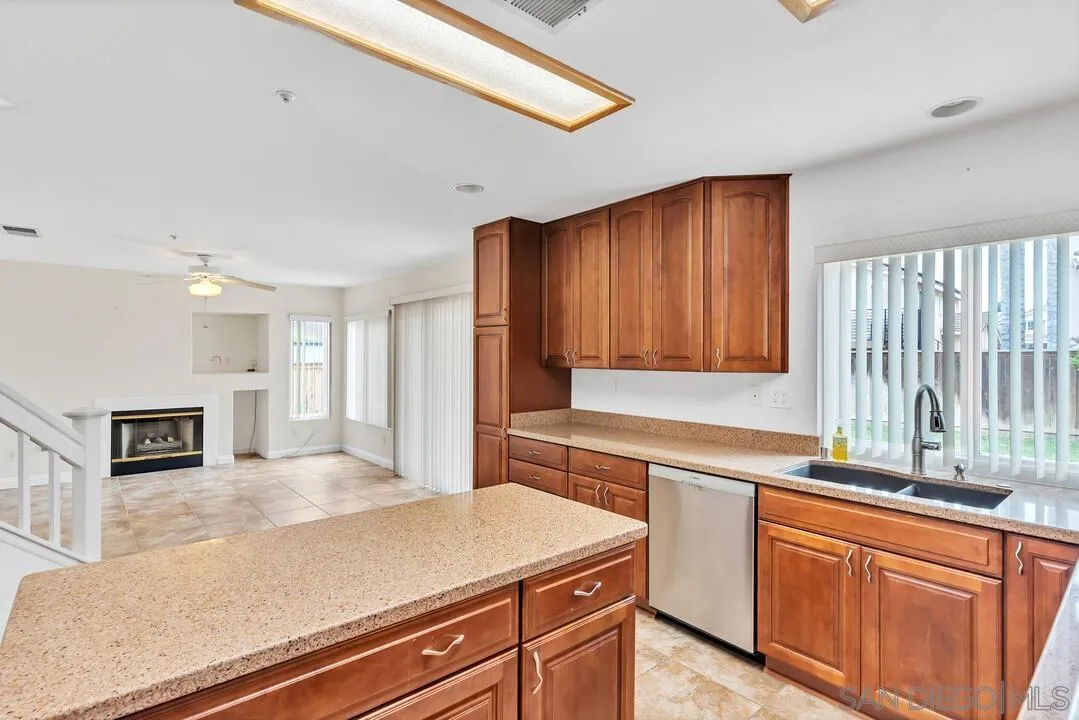117 Willow Pond Road Santee, CA 92071 - Photo 16 of 49 a kitchen with stainless steel appliances granite countertop a sink and cabinets